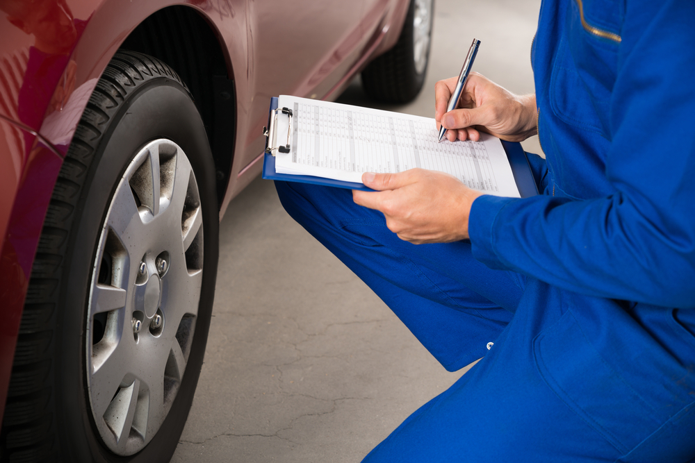 Person doing vehicle inspection
