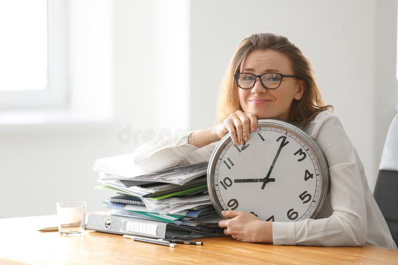 Woman holding clock